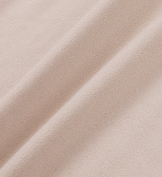 Close-up of soft, light beige fabric with gentle folds and a smooth texture, ideal for Stay Active Biker Short - Elephant/White, perfect for high waisted sportswear.