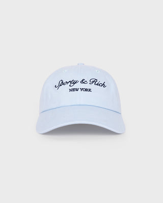 Light blue cap with 'Sporty & Rich New York' text on a white background
