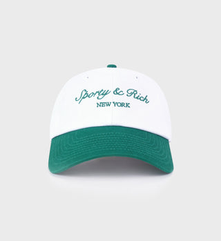 White and green cap with 'Sporty & Rich New York' text on a light gray background