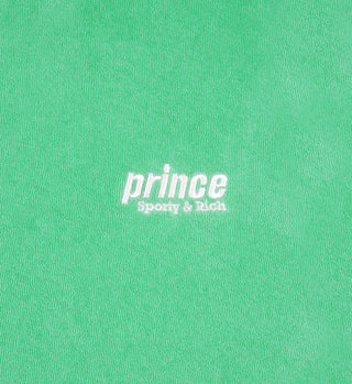 Clean mint fabric background with white text reading Prince Sporty & Rich in the center, highlighting the 100% cotton quality of the Prince Sporty Terry Polo - Clean Mint/White.