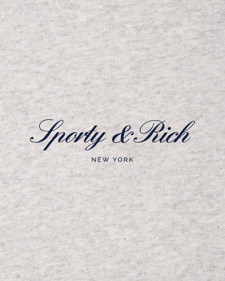 Text 'Sporty & Rich New York' on a textured gray background