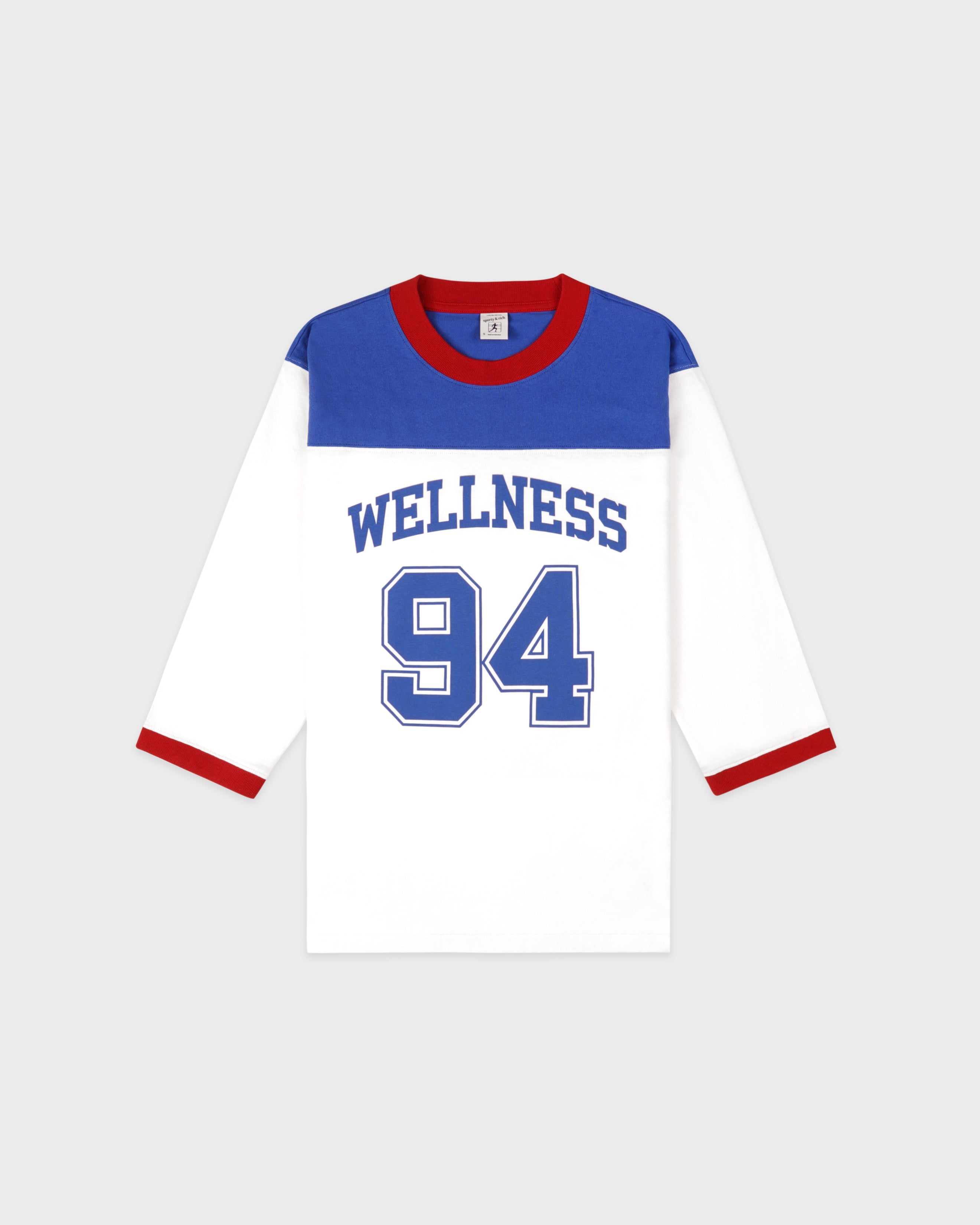 Baseball jersey with 'Wellness 94' text on a white background
