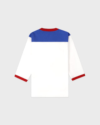 White long-sleeve shirt with blue and red accents on a light gray background