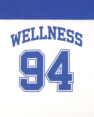 Text 'WELLNESS 94' in blue on a white background with a blue border.