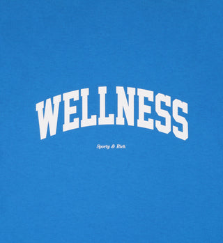 Wellness Ivy T-Shirt - Royal Blue/White features bold white WELLNESS text with Sporty & Rich beneath, made from 100% cotton in the USA.