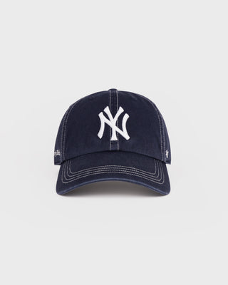Navy blue baseball cap with white logo on a light gray background