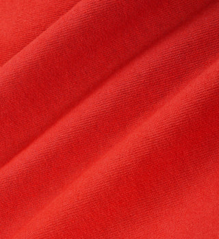 Close-up of red fabric with a textured surface