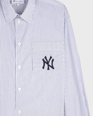 White and blue striped shirt with a black logo on a light gray background