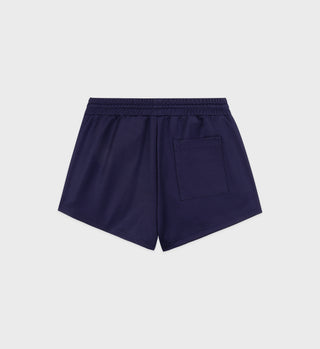 Navy blue shorts with a pocket on a light gray background