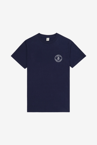 A navy blue short-sleeve crewneck t-shirt with a small white circular logo printed on the left chest, displayed flat against a light gray background.