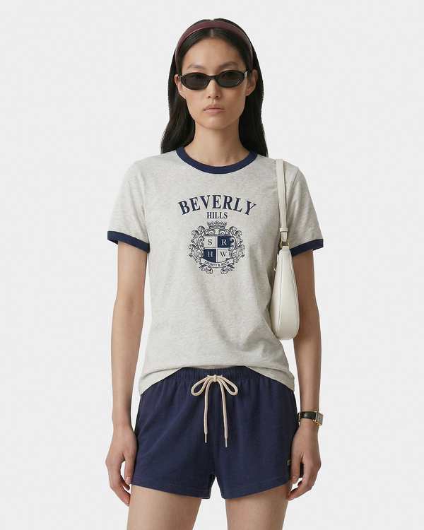Signature Logo Lounge Short - Navy, crafted from 100% cotton in a low-waisted silhouette, features a white logo label on the left leg and is showcased against a plain white background.