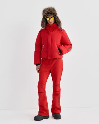 Bright red Drea Bold Logo Ski Jacket - Rosso with black text on the left sleeve and zippered pockets.