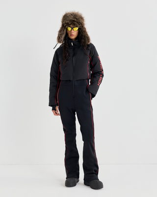 Dulce Bold Logo Hooded Ski Suit in black with a front zipper and red piping accents.