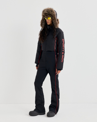 Dulce Bold Logo Hooded Ski Suit in black with a front zipper and red piping accents.