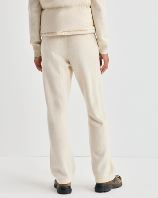Ivana S Logo Cashmere Trousers in cream, featuring a wide-leg knit, drawstring waist, and embroidered hip logo.