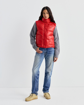 Red Devano Bold Logo Mountain Puffer Vest with a high collar and white chest logo in technical nylon.