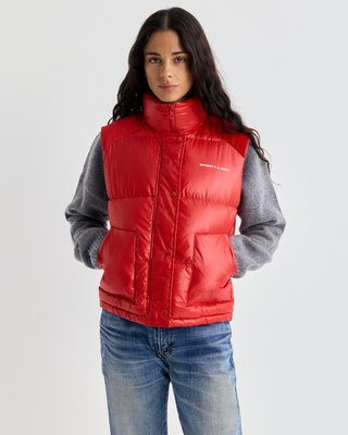 Red Devano Bold Logo Mountain Puffer Vest with a high collar and white chest logo in technical nylon.