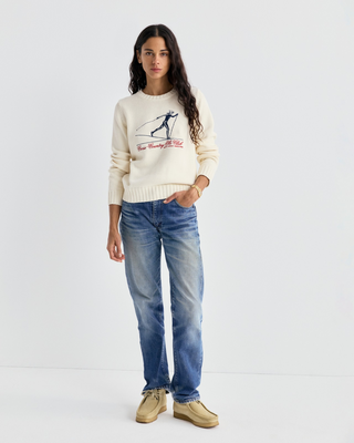 Ivylee Cross Country Knitted Sweater - Ecru: a cream, breathable knit with a skier graphic and red club text.