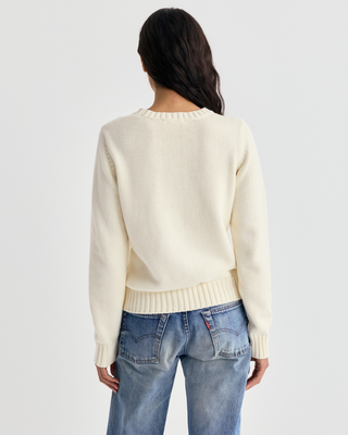 Ivylee Cross Country Knitted Sweater - Ecru: a cream, breathable knit with a skier graphic and red club text.