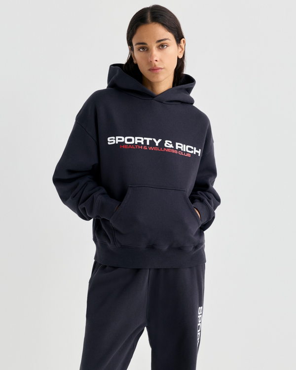 Black Elaine Bold Health Hoodie with Sporty & Rich Health & Wellness Club text on the chest.