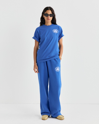Vibrant blue Cameron Chateau Tshirt featuring a white circular logo on the chest.