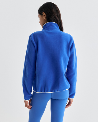 Emma Bold Logo Polar Sweatshirt in vibrant blue with a snap-button mock neck and a cream chest pocket.