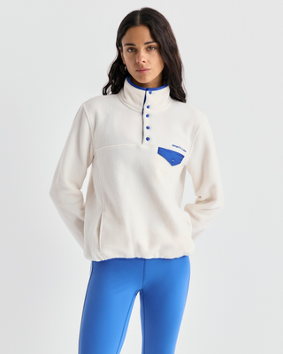 Emma Bold Logo Polar Sweatshirt in cream-colored polyester fleece with a snap-button placket and blue trim.