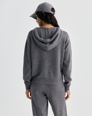 Isac S Logo Cashmere Zip Hoodie in medium heather gray with a drawstring hood and a small embroidered chest logo.