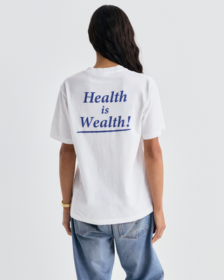 Cameron Health is Wealth Tshirt - White crewneck with blue text on the chest.