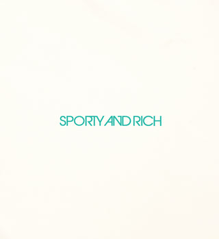 The Carla One Piece - Cream features a cream background with green SPORTY AND RICH text centered, crafted from ECONYL® regenerated nylon.