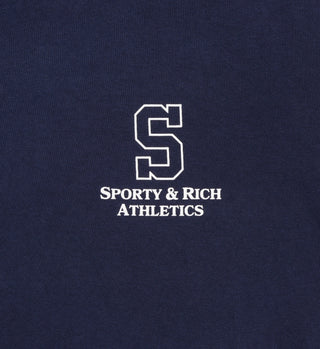 The College T-Shirt - Navy is made in the USA from USA-grown cotton, featuring a large white S with SPORTY & RICH ATHLETICS below.