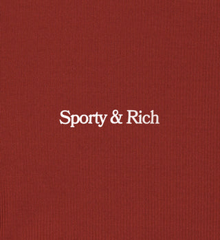 White Sporty & Rich text is centered on a textured, maroon background inspired by the Serif Logo Ribbed Legging in Maroon/White.