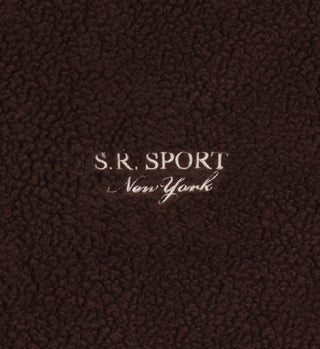 Stay cozy in the Sherpa Quarter Zip - Chocolate/Cream, made from warm brown fleece with S.R. SPORT New York embroidered in white at the center. Perfect for layering and crafted in Portugal for quality and style.