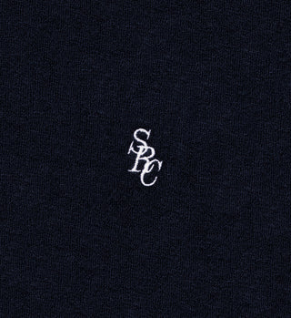 The SRC Terry Short - Navy is made in Portugal from 100% cotton terry cloth, featuring white embroidered overlapping S, P, and C letters at the center.