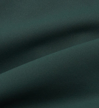 The Sports Bra N.02 - Forest features dark green fabric with a soft, smooth texture and gentle, flowing folds for comfort and support—perfect for active wear.