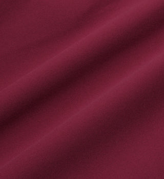 Close-up of smooth merlot fabric with soft diagonal folds and a matte texture, just like the luxe Sports Bra N.02 - Merlot from Sporty & Rich.