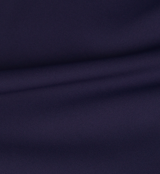 Close-up of Sports Bra N.03 - Navy’s smooth, dark blue fabric with gentle folds and a soft texture, delivering the perfect blend of comfort and support—ideal for active wear.