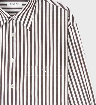 The SRC Oversized Shirt - Chocolate Striped is a brown and white vertical striped cotton poplin button-up with a chest pocket and collar, made in Portugal.
