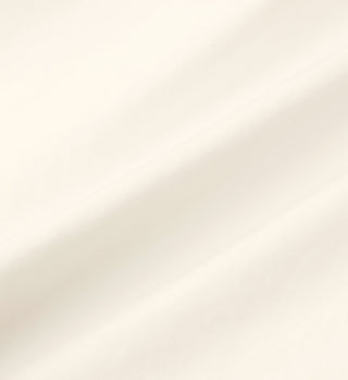 The SRC Oversized Shirt - Cream features smooth, off-white cotton poplin fabric with subtle soft folds and gentle shadows.