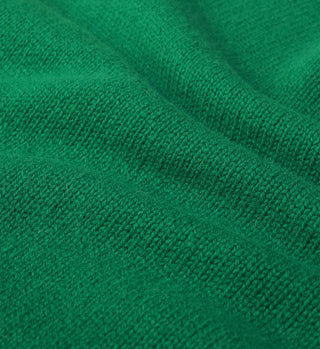 Close-up of the SRC Wool Crewneck - Kelly, highlighting the soft, green lambswool knit with textured weave details.